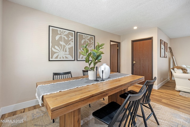 295 Sandia Dr, Fernley, NV 89408 - dining room featuring baseboards, a textured ceiling, light wood-style flooring, and recessed lighting