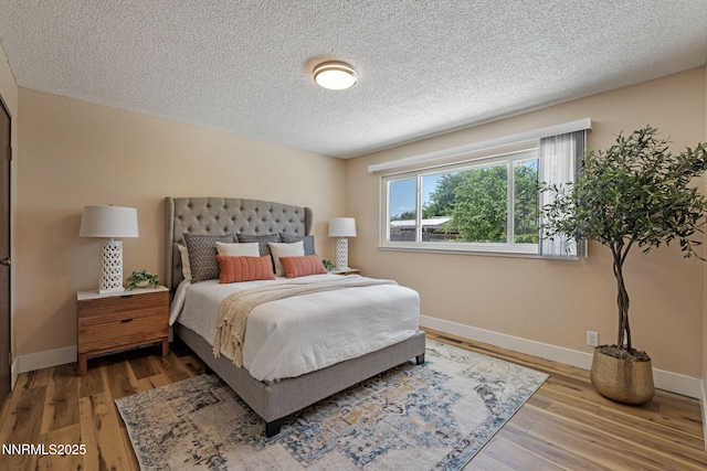 295 Sandia Dr, Fernley, NV 89408 - bedroom featuring a textured ceiling, baseboards, and wood finished floors