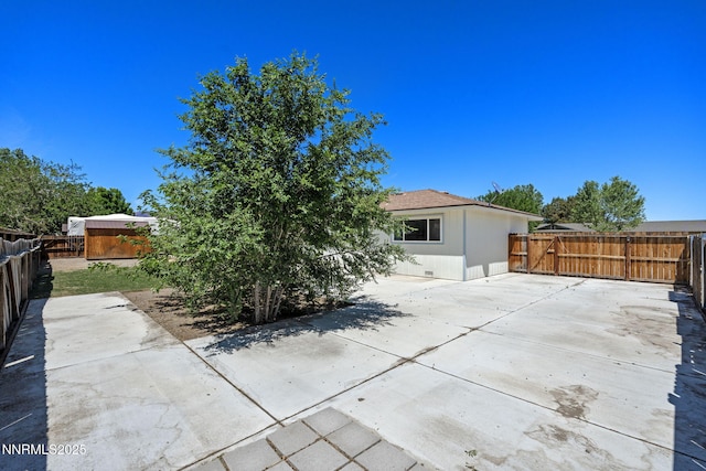 295 Sandia Dr, Fernley, NV 89408 - back of property with a patio, a fenced backyard, and an outbuilding