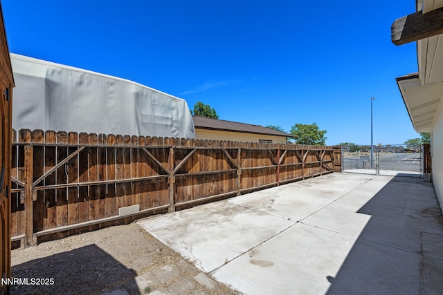 295 Sandia Dr, Fernley, NV 89408 - fenced backyard with a patio area