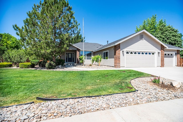 867 Mahogany Dr, Minden, NV 89423 - ranch-style home with an attached garage, driveway, a front yard, and brick siding