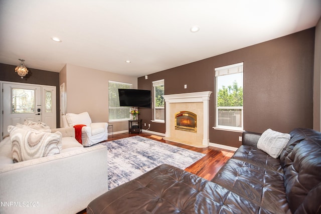 867 Mahogany Dr, Minden, NV 89423 - living area featuring wood finished floors, recessed lighting, a chandelier, baseboards, and a tile fireplace