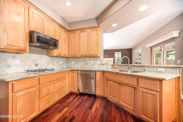867 Mahogany Dr, Minden, NV 89423 - kitchen with black microwave, a sink, light brown cabinets, a peninsula, and dark wood-style flooring