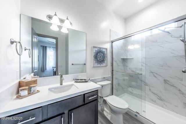1536 Elk Run Trl, Reno, NV 89523 - bathroom featuring a marble finish shower, vanity, and toilet