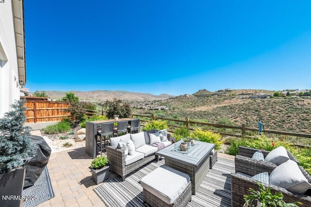 1536 Elk Run Trl, Reno, NV 89523 - fenced backyard featuring an outdoor living space, a mountain view, a patio, and outdoor dining space