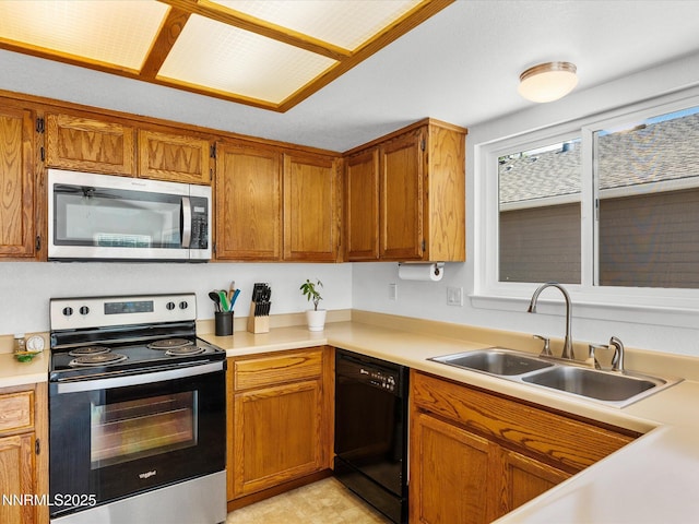 1772 Shamrock Cir, Minden, NV 89423 - kitchen featuring stainless steel appliances, a sink, light countertops, and brown cabinets