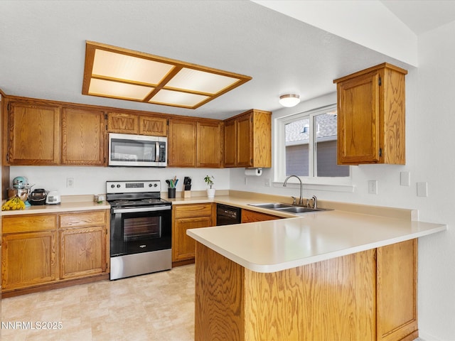 1772 Shamrock Cir, Minden, NV 89423 - kitchen with appliances with stainless steel finishes, a sink, a peninsula, light countertops, and brown cabinets