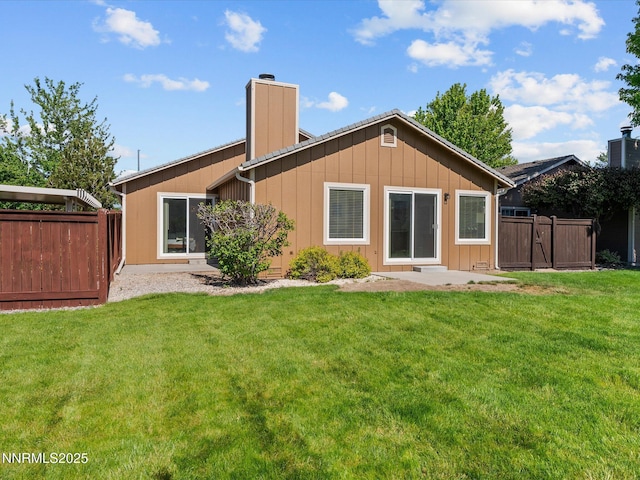 1772 Shamrock Cir, Minden, NV 89423 - back of house featuring a chimney, board and batten siding, and a gate