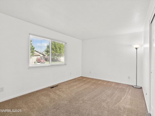 1772 Shamrock Cir, Minden, NV 89423 - spare room featuring light carpet and baseboards