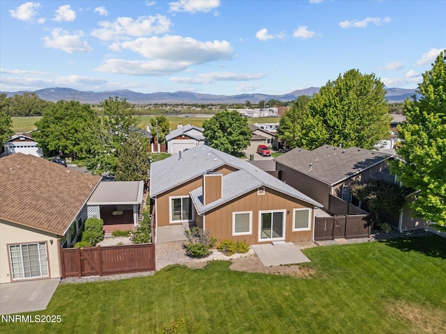 1772 Shamrock Cir, Minden, NV 89423 - back of property featuring a mountain view, a gate, board and batten siding, and a residential view