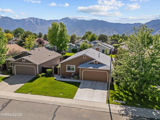 1772 Shamrock Cir, Minden, NV 89423 - view of front of house featuring concrete driveway, a garage, a mountain view, and a residential view
