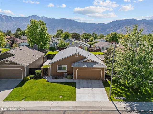 1772 Shamrock Cir, Minden, NV 89423 - view of front of home with an attached garage, driveway, a mountain view, and a residential view