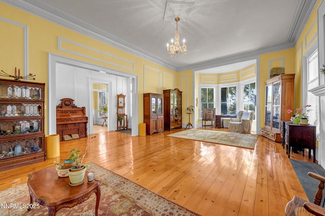 2350 Jacks Valley Rd, Genoa, NV 89411 - living area with a chandelier, wood-type flooring, crown molding, and a decorative wall
