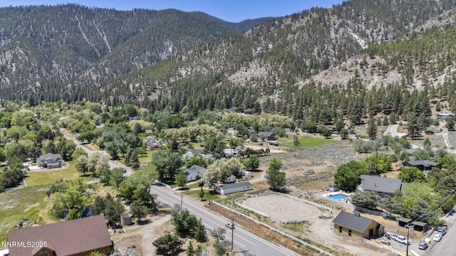 2350 Jacks Valley Rd, Genoa, NV 89411 - drone / aerial view of a mountainous background and a heavily wooded area
