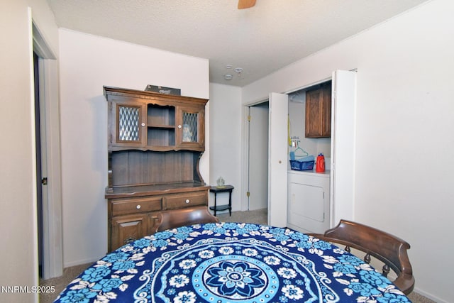 2213 Kietzke Ln Unit H, Reno, NV 89502 - bedroom featuring carpet, washer / dryer, and a textured ceiling