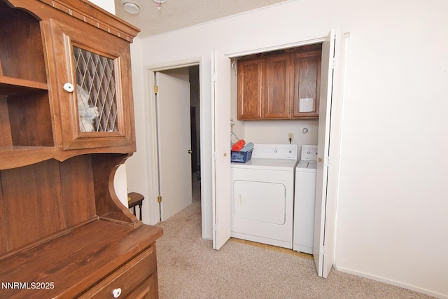 2213 Kietzke Ln Unit H, Reno, NV 89502 - washroom with cabinet space, separate washer and dryer, and light colored carpet