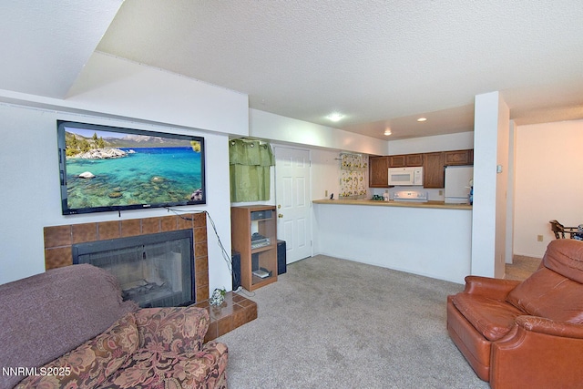 2213 Kietzke Ln Unit H, Reno, NV 89502 - living area featuring carpet flooring, a fireplace, recessed lighting, and a textured ceiling