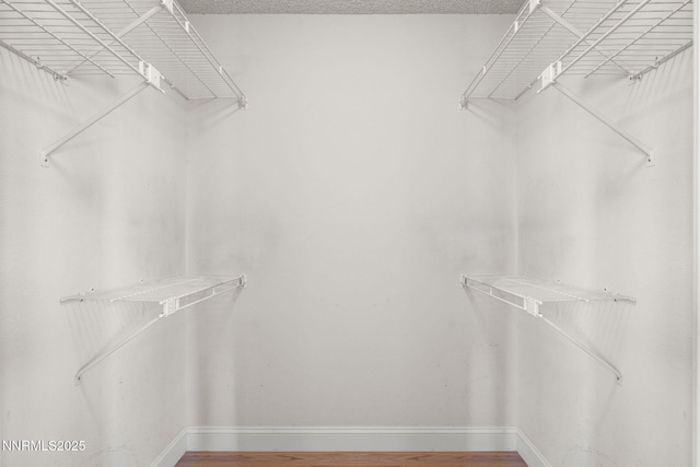2875 Idlewild Dr Unit 106, Reno, NV 89509 - walk in closet featuring wood finished floors