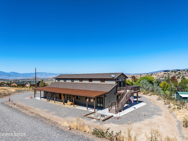 2620 Old Ranch Rd, Gardnerville, NV 89410 - view of front of home with stairway and a deck with mountain view