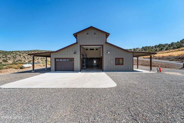 2620 Old Ranch Rd, Gardnerville, NV 89410 - view of front of home featuring a garage, concrete driveway, and an outbuilding