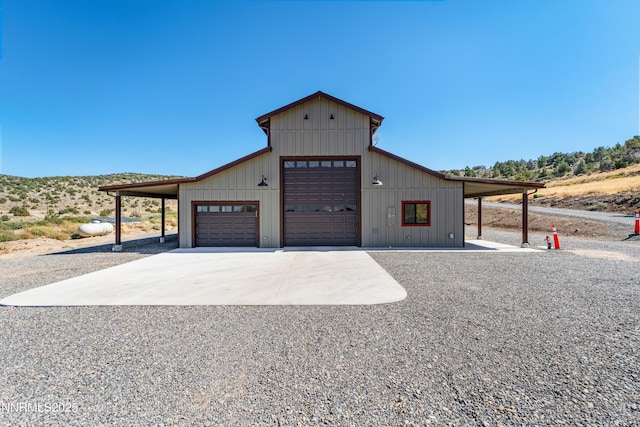 2620 Old Ranch Rd, Gardnerville, NV 89410 - view of front of home featuring a garage, gravel driveway, and an outdoor structure