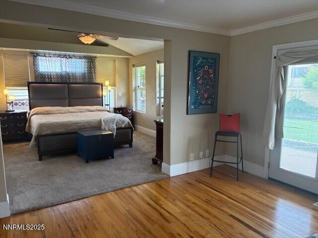 2195 W Plumb Ln, Reno, NV 89509 - bedroom with wood finished floors, multiple windows, baseboards, and ornamental molding