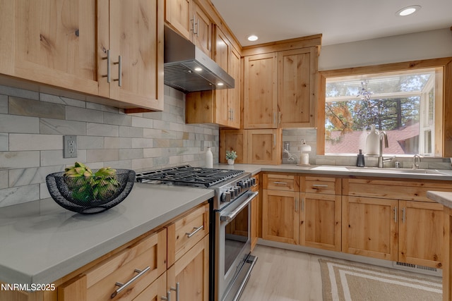 471 Kent Way, Zephyr Cove, NV 89448 - kitchen featuring gas range, under cabinet range hood, a sink, light brown cabinets, and recessed lighting