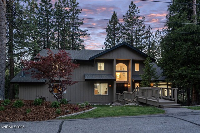 471 Kent Way, Zephyr Cove, NV 89448 - view of front facade featuring roof with shingles, a wooden deck, and a yard