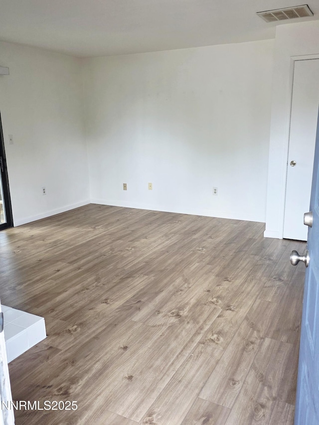 2205 Kietzke Ln Unit E, Reno, NV 89502 - empty room with wood finished floors and baseboards