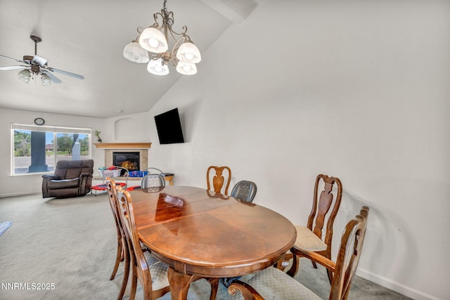 753 Divot Dr, Fernley, NV 89408 - dining area featuring light carpet, a fireplace, ceiling fan, a chandelier, and baseboards