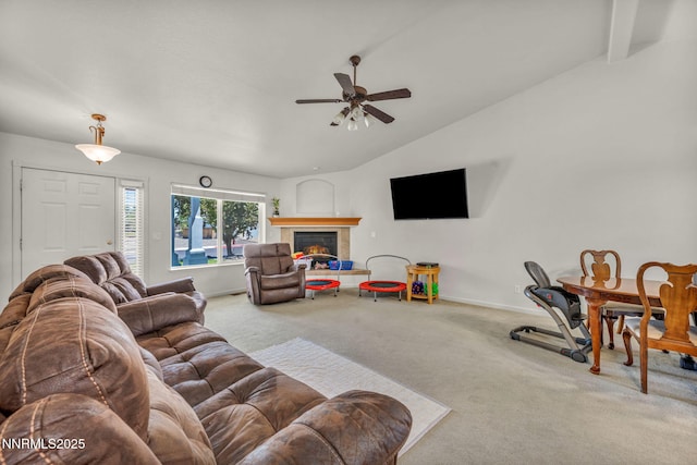 753 Divot Dr, Fernley, NV 89408 - living area featuring lofted ceiling, carpet floors, ceiling fan, baseboards, and a tiled fireplace