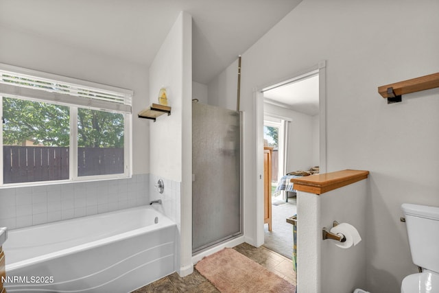 753 Divot Dr, Fernley, NV 89408 - bathroom with a garden tub, a stall shower, and toilet