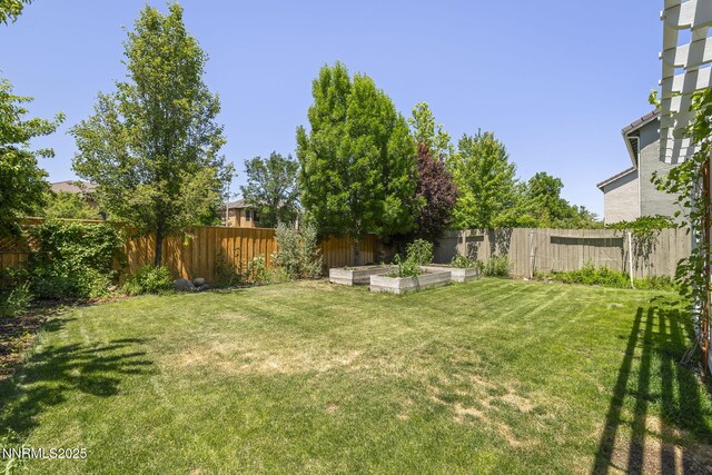 9783 Northrup Dr, Reno, NV 89521 - fenced backyard featuring a garden