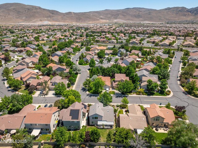 9783 Northrup Dr, Reno, NV 89521 - aerial perspective of suburban area featuring a mountainous background