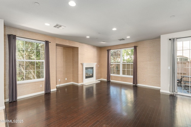 1875 Wind Ranch Rd Unit A, Reno, NV 89521 - unfurnished living room with baseboards, healthy amount of natural light, recessed lighting, and wood finished floors