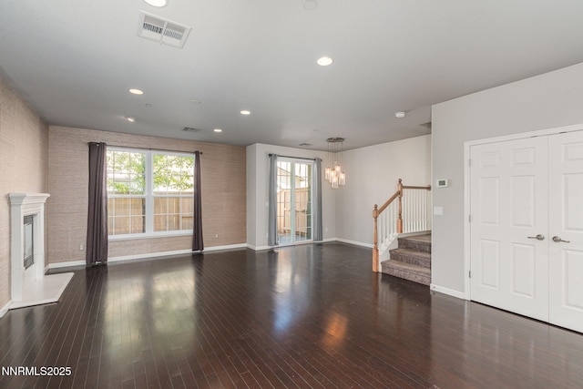 1875 Wind Ranch Rd Unit A, Reno, NV 89521 - unfurnished living room with a chandelier, stairway, plenty of natural light, baseboards, and recessed lighting