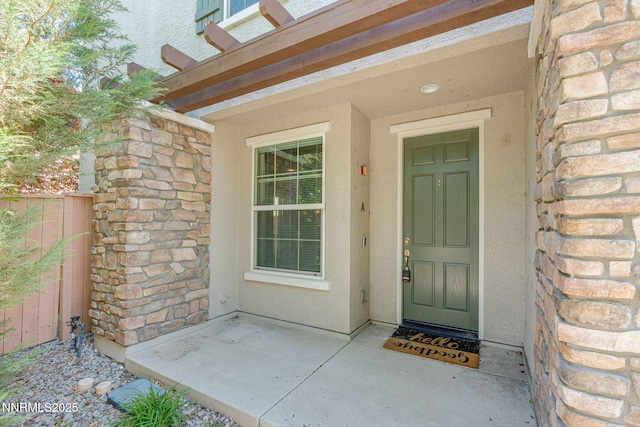 1875 Wind Ranch Rd Unit A, Reno, NV 89521 - doorway to property featuring stucco siding