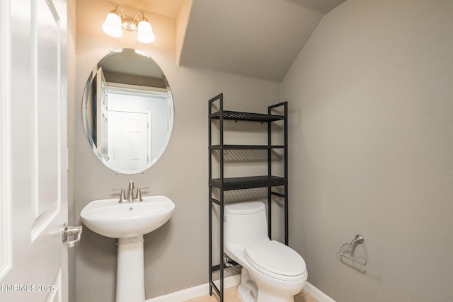 1875 Wind Ranch Rd Unit A, Reno, NV 89521 - half bath featuring toilet, baseboards, and vaulted ceiling