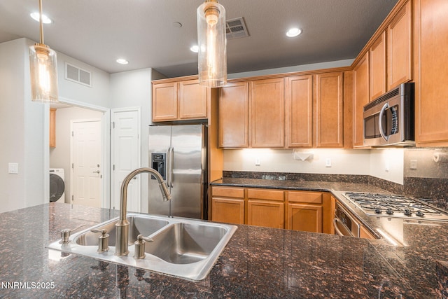1875 Wind Ranch Rd Unit A, Reno, NV 89521 - kitchen with appliances with stainless steel finishes, a sink, washer / dryer, decorative light fixtures, and recessed lighting