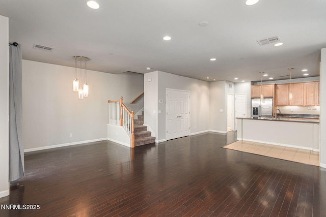 1875 Wind Ranch Rd Unit A, Reno, NV 89521 - unfurnished living room featuring stairs, recessed lighting, dark wood finished floors, baseboards, and a chandelier