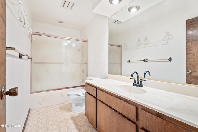 2196 Pebble Beach Dr, Reno, NV 89502 - full bathroom featuring toilet, enclosed tub / shower combo, vanity, and tile patterned floors