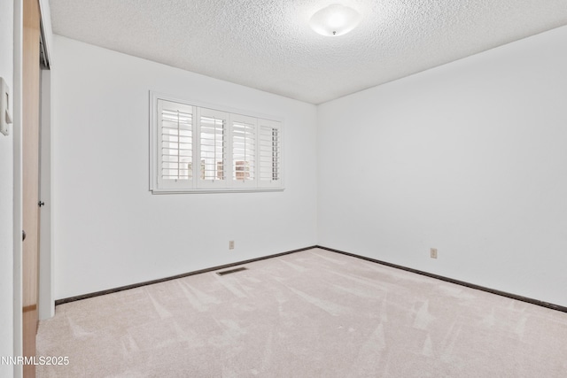 2196 Pebble Beach Dr, Reno, NV 89502 - empty room featuring a textured ceiling, carpet floors, and baseboards