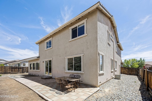 7145 Beacon Dr, Reno, NV 89506 - rear view of house featuring stucco siding, a patio, a fenced backyard, and cooling unit