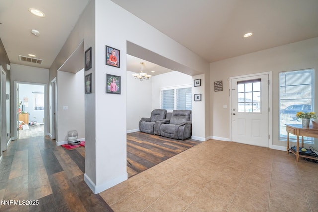 211 Jimmys Peak Ct, Fernley, NV 89408 - foyer featuring wood finished floors, a chandelier, recessed lighting, and baseboards