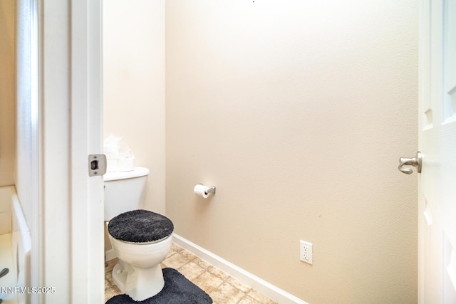 211 Jimmys Peak Ct, Fernley, NV 89408 - bathroom featuring baseboards, toilet, and tile patterned flooring