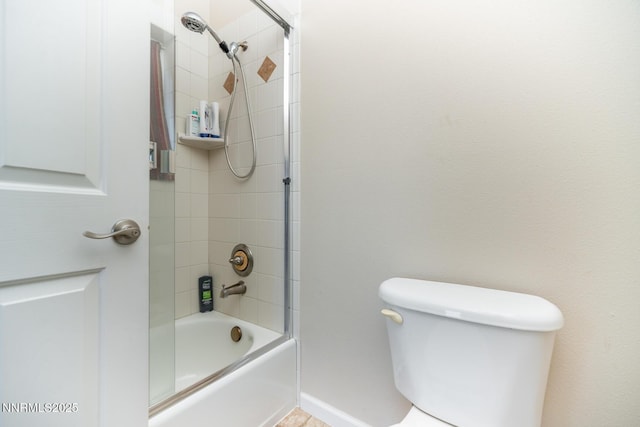 211 Jimmys Peak Ct, Fernley, NV 89408 - bathroom with bathing tub / shower combination, toilet, and baseboards