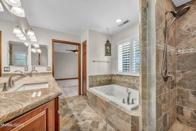 4215 Wild Eagle Ter, Reno, NV 89511 - bathroom featuring a garden tub, a stall shower, double vanity, and a chandelier