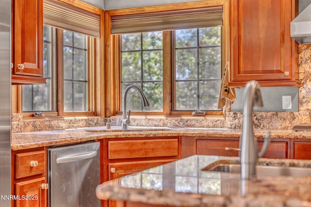 4215 Wild Eagle Ter, Reno, NV 89511 - kitchen featuring wall chimney range hood, dishwasher, light stone counters, and brown cabinetry