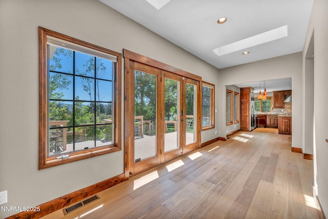 4215 Wild Eagle Ter, Reno, NV 89511 - doorway with a skylight, plenty of natural light, french doors, light wood-style floors, and recessed lighting