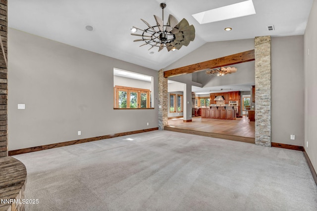 4215 Wild Eagle Ter, Reno, NV 89511 - unfurnished living room with a skylight, light carpet, a chandelier, and high vaulted ceiling